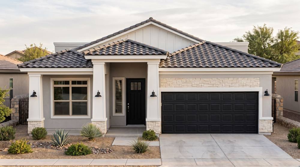 Rendering of the Heritage elevation: a tile hip roof, white square columns on stone bases, gray stucco and a stone band over the garage